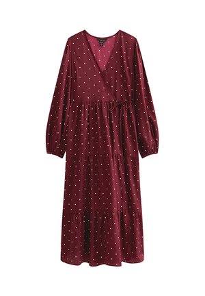 Wijnrode wikkeljurk met lange mouwen, witte stippen, gelaagde rok en een strikdetail in de taille. Gemaakt van een zachte, lichte stof.