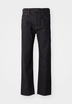 Dark blue denim jeans with straight legs, brass button closure, orange stitching, and five-pocket design. Classic fit and sturdy texture.