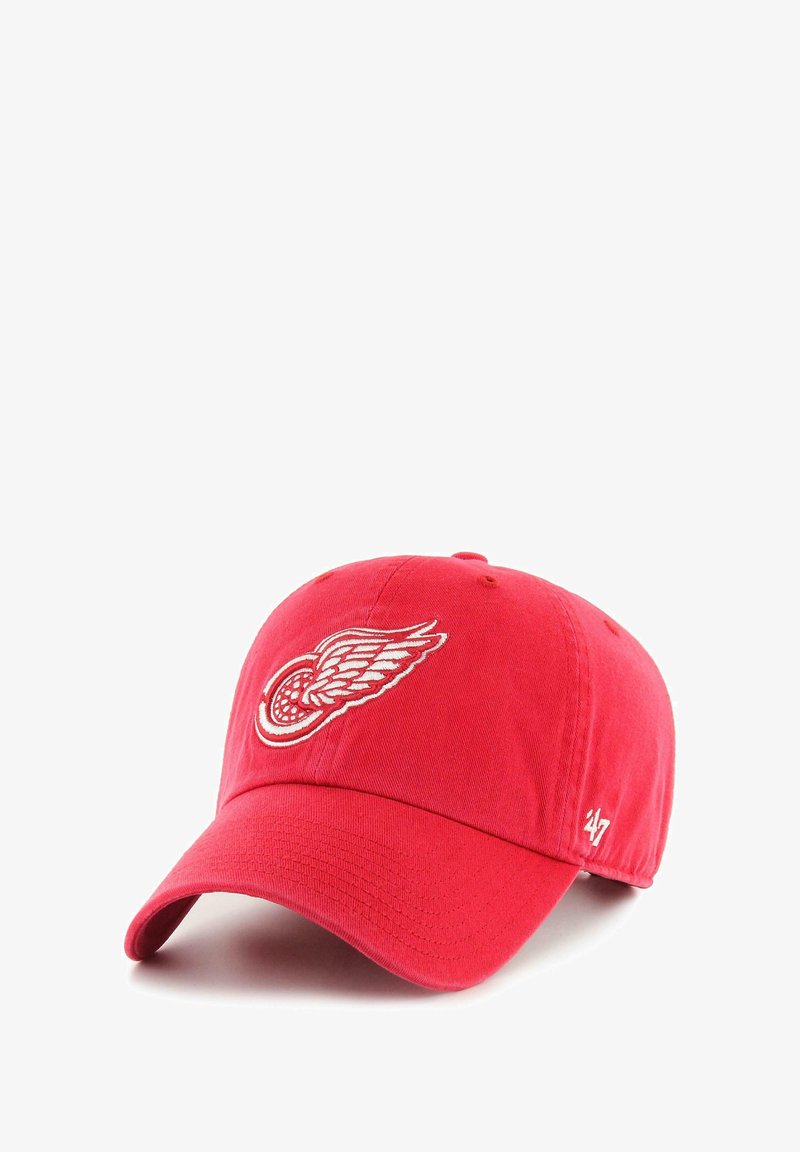 Red baseball cap with a white winged wheel logo on front and '47' embroidered on side, displayed against a white background.