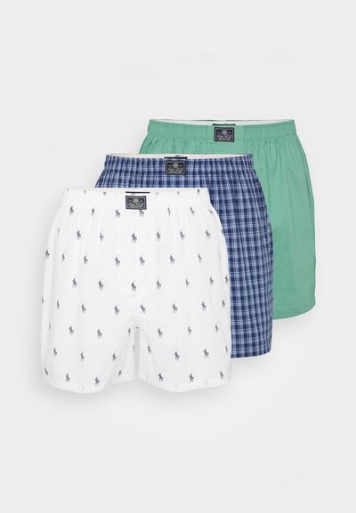 Három pár boxer alsó: fehér kék mintával, kék kockás és zöld. Rugalmas derékrésszel és puha pamut anyaggal rendelkeznek.