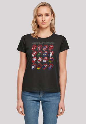 Black crew-neck t-shirt featuring The Rolling Stones logo with various national flags in a grid pattern. Short sleeves, relaxed fit.