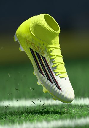 F50 CLUB MID CUT FIRM GROUND MULTI GROUND UNISEX - Futballcipők műfüves pályára - team solar yellow 2/core black/lucid red