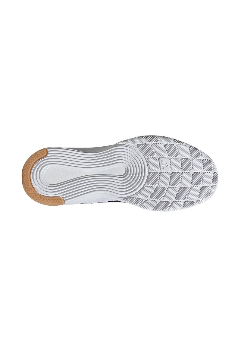 Suela de zapato deportivo blanca con agarre texturizado y un acento de goma. Presenta surcos concéntricos y una superficie con patrón para mayor tracción.