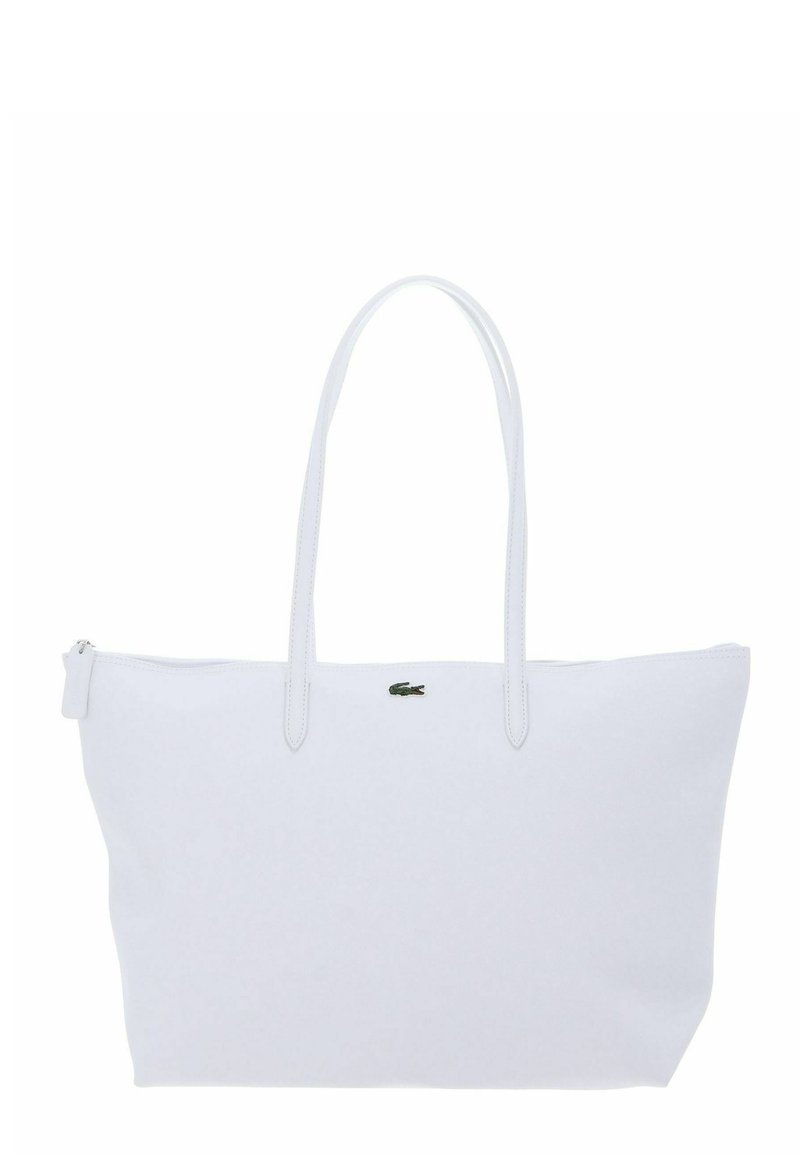 Borsa tote bianca con due manici lunghi, chiusura con cerniera e piccolo logo a forma di coccodrillo verde centrato nella parte superiore.