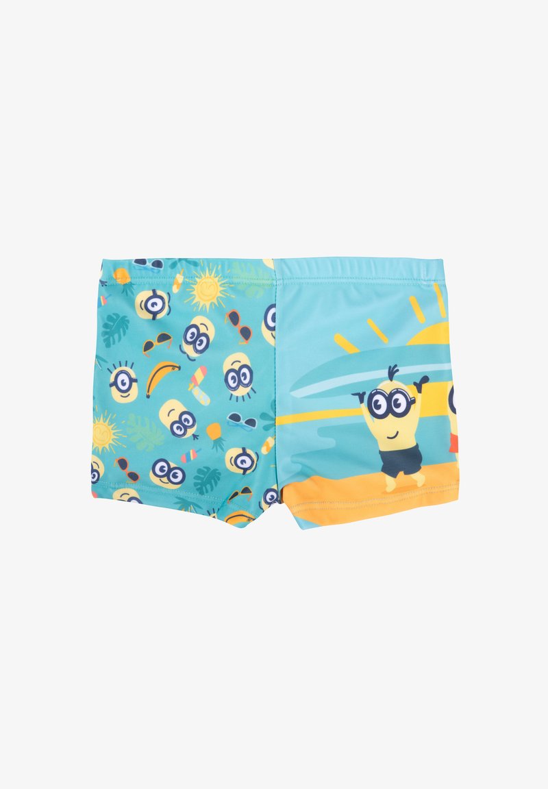 Costumi da bagno per bambini in turchese con motivi dei Minion, che presentano soli ed elementi tropicali; dettagli gialli, elastico in vita e materiale comodo.