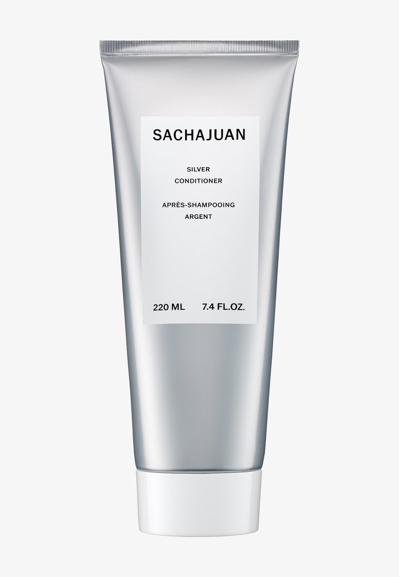 Tube argenté élégant de l'après-shampooing Sachajuan Silver avec un bouchon blanc, étiqueté 220 ml (7,4 fl.oz), pour les soins capillaires après shampooing.
