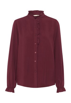 Blusa burdeos de manga larga con cuello alto volante y cierre de botones en la parte delantera. Presenta puños fruncidos y una textura de tela suave.