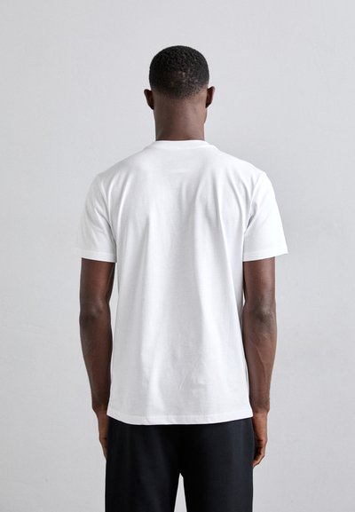 MOSCHINO T-shirt imprimé - fantasia bianco