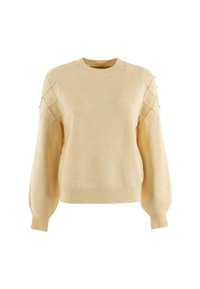 Maglione color crema con scollatura tonda e maniche a palloncino. Presenta motivi a diamante testurizzati e piccoli accenti decorativi sulle spalle.