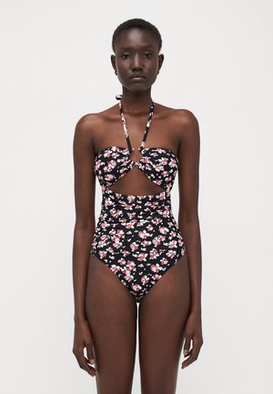 Black floral swimsuit with a bandeau top, cut-out detail, halter neck straps, and a high-waisted bottom featuring pink and white flowers.