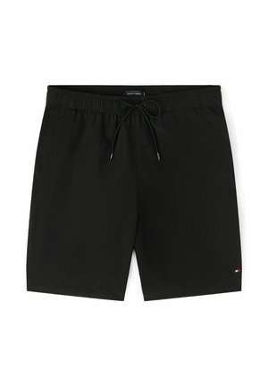 Shorts de bain pour hommes noirs avec taille élastique et cordon de serrage, présentant un petit logo sur la partie inférieure de la jambe gauche.