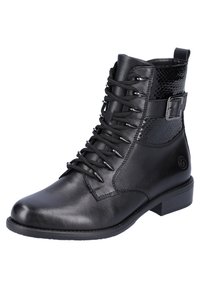 Bottines noires avec cuir lisse et accents en imprimé serpent texturé. Elles possèdent des lacets, une boucle sur le côté et un petit talon empilé.