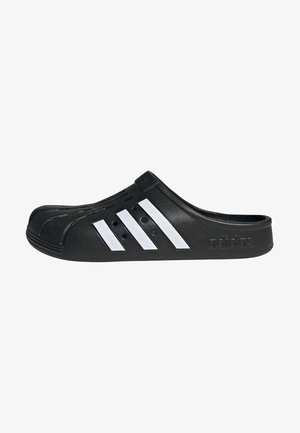 Black slip-on clog made of rubber with three white stripes on the side, textured upper surface, and ventilation holes near the toe.