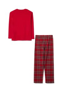 Rode longsleeve top gecombineerd met rode geruite broek met groene en gele accenten, gemaakt van een zachte stof met een relaxte pasvorm.
