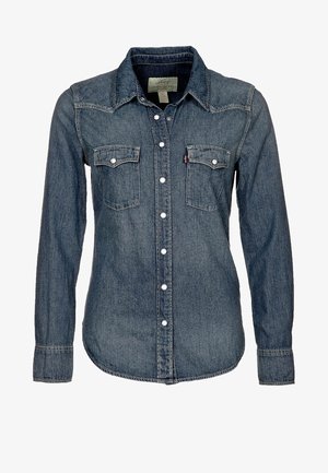 Denim overhemd met lange mouwen, knoopsluiting, puntige kraag en twee borstzakken met drukknoopsluiting.
