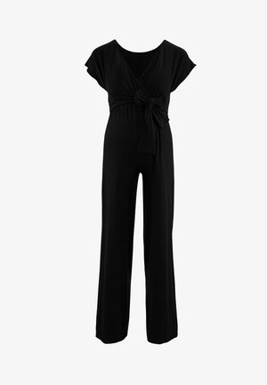 Zwarte jumpsuit met korte kapmouwen, een gewikkelde lijfje vastgebonden in de taille en wijde broekspijpen van zachte, rekbare stof.