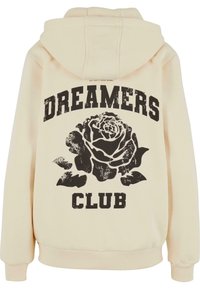Helle Kapuzenjacke in Cremefarbe mit einem großen schwarzen Grafikdesign einer Rose unter dem Text "DREAMERS CLUB." Weiches Baumwollmaterial mit gerippten Bündchen.