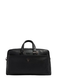 Sac de voyage en cuir noir avec deux poignées supérieures, ferrures dorées, une poche avant et un logo embossé centré sur le devant.