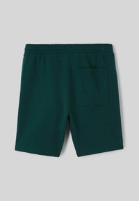 Shorts en coton vert foncé avec une taille élastique, dotés d'une poche plaquée à l'arrière et d'une texture lisse.