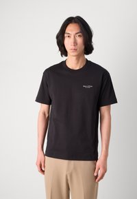 Black cotton T-shirt with a crew neck and short sleeves, featuring a small white "Marc O'Polo" logo on the left chest area.