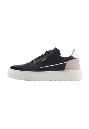 Black leather sneaker with gray suede accents, white rubber sole, and perforated details. Lace-up design with side branding.
