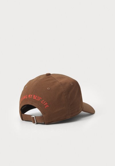 Brown cotton cap with a curved brim and adjustable strap, featuring red embroidered text "LIVING MY BEST LIFE" on the back.
