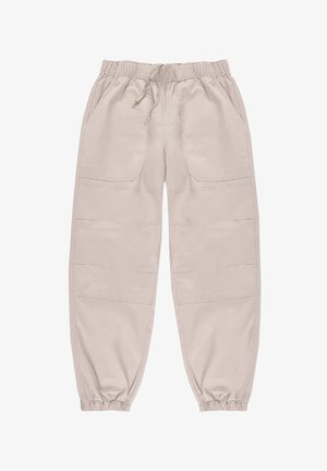 Beżowe spodnie z elastycznym pasem i sznurkiem, dwa przednie kieszenie oraz elastyczne mankiety. Materiał wydaje się gładki z delikatnym połyskiem.