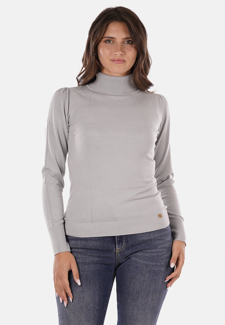 Maglione a dolcevita grigio chiaro con texture a coste, silhouette aderente e maniche lunghe. Presenta un sottile emblema decorativo all'orlo.