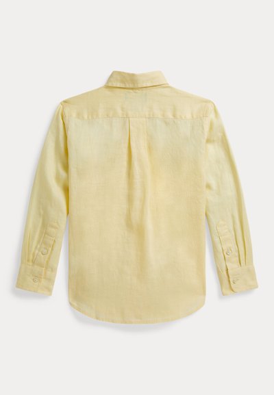 Ελαφρύ κίτρινο πουκάμισο με μακριά μανίκια και απαλή υφή, μανσέτες με κουμπιά και πλάτη με πτυχώσεις για άνεση. Απλός σχεδιασμός για το γιακά.