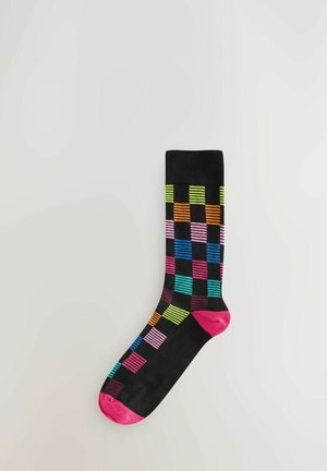 Black sock featuring a multicolored striped checker pattern, with vibrant shades of pink, green, blue, and orange; pink toe accents.