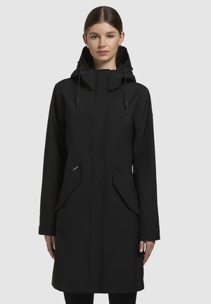 Black waterproof coat with a hood, front zip closure, two large side pockets, and adjustable drawstrings. Smooth fabric texture and knee-length design.