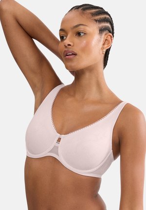 Jasnoróżowy biustonosz o gładkiej fakturze, kwiatowym wzorze, głębokim dekolcie i ozdobnym wykończeniu. Posiada fiszbiny i regulowane ramiączka.