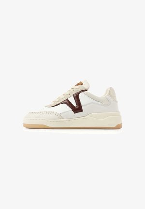 Low-top beige sneaker with cream sole, brown "V" logo on side, stitched detailing, and light tan outsole shown in right profile.