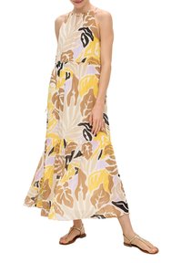 Maxikleid mit Halterneck, ausgestattet mit einem floralen Muster in Gelb, Beige, Schwarz und Lavendel. Hergestellt aus leichtem Stoff mit einem entspannten Schnitt.
