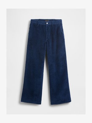 Tumši zili kordura bikses ar platām kājām, ribota faktūra un parasta jostasvieta ar priekšējo pogu aizdari.