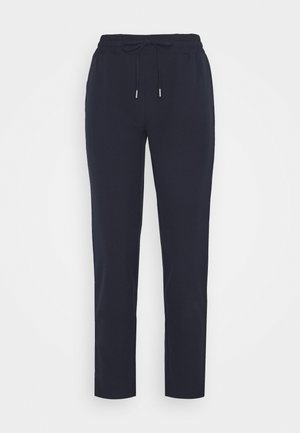 Navy Jogginghose mit elastischem Taillenbund und Kordelzugverschluss, ausgestattet mit einer glatten Textur und geradem Bein Design. Silberne Hardware-Akzente sind enthalten.