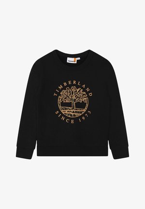Sweatshirt noir avec un col rond, arborant un logo d'arbre orange et le texte "TIMBERLAND SINCE 1973". Tissu doux avec des poignets à côtes.
