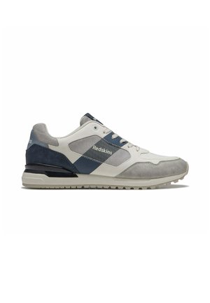 Baskets décontractées en gris, bleu marine et blanc avec le logo « Redskins » sur le côté, design à lacets et semelle nervurée pour la traction.