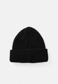 Black knitted beanie featuring a ribbed texture with a folded cuff at the base, designed in a classic shape.