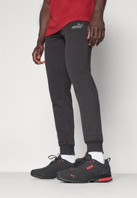 Puma SWEATPANTS  - Donji dijelovi trenirke - puma black