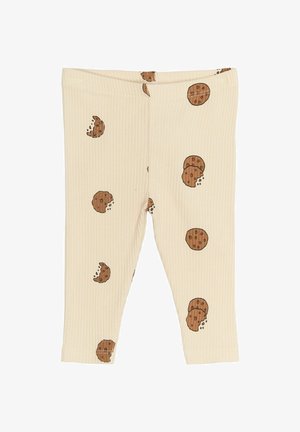 Rebraste, kremaste legice z vzorcem piškotkov v rjavi barvi. Vsebujejo majhne motive celih in ugriznjenih piškotkov po celotni površini.