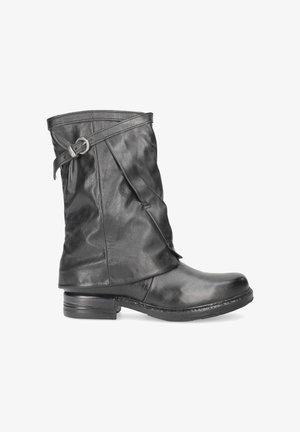 Black leather ankle boot with a slouched design, buckle accent on the shaft, and a low stacked heel. Smooth texture with minimal stitching details.