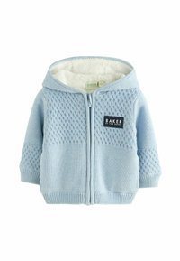 Lyseblå zip-up hoodie med et struktureret strikkemønster på toppen og glat stof nedenunder, fleece-foring indeni, og et sort mærke.