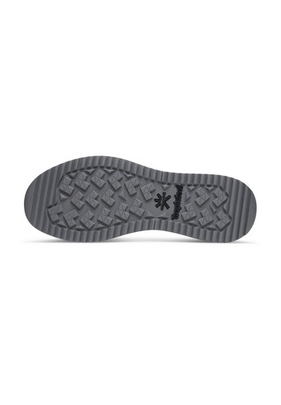 Black rubber shoe sole with a textured, patterned surface featuring diamond-shaped lugs for traction and a ridged design along the edge.
