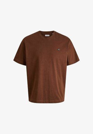 Hnedé bavlnené tričko s okrúhlym výstrihom a krátkymi rukávmi. Obsahuje malú nášivku loga na ľavej oblasti hrudníka. Hladká textúra.
