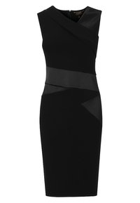 Svart, ärmlös klänning med asymmetrisk design. Har ett slätt tyg med satinaccenter och en figurnära silhuett. Dragkedja i ryggen.