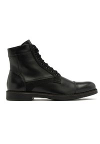 Czarne skórzane botki do kostki z okrągłym noskiem, sznurowane z przodu, z zamszowymi akcentami. Wyposażone w niski obcas i detaliczne przeszycia wzdłuż podeszwy.