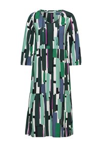 Tulossa oleva mekko, jossa on V-pääntie, pitkät hihat, vihreitä, sinisiä ja purppuran sävyisiä lohkokuvioita valkoisella taustalla, ja kerroksellinen helma.