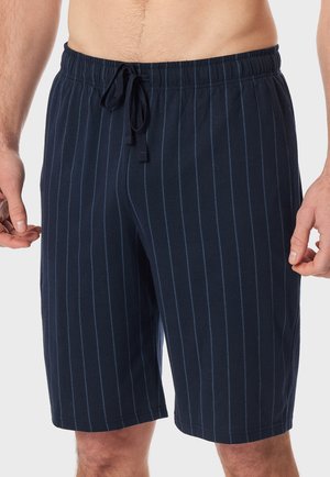 Shorts rayés bleu marine fabriqués en tissu doux, avec une taille élastique à cordon de serrage et une coupe au niveau des genoux.