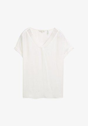 Fehér, rövid ujjú, V-nyakú felső, könnyű anyagból készült. Felgöngyölt ujjakkal és laza szabással rendelkezik, sima textúrájú.